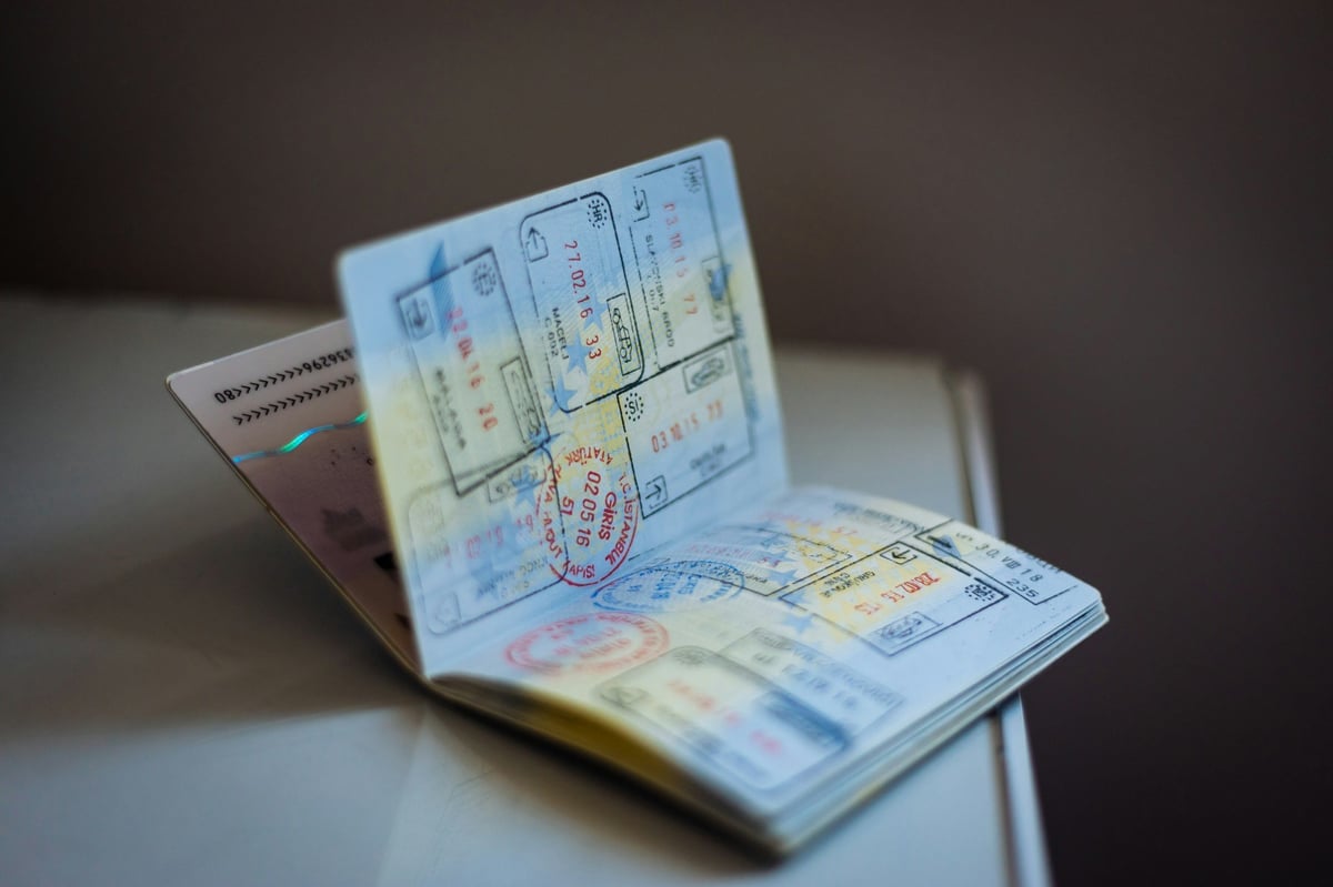 An open passport showing entry stamps