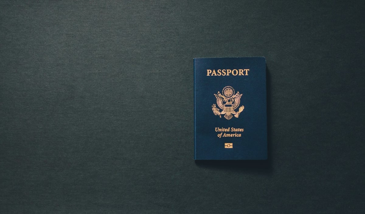 A US passport on a dark surface