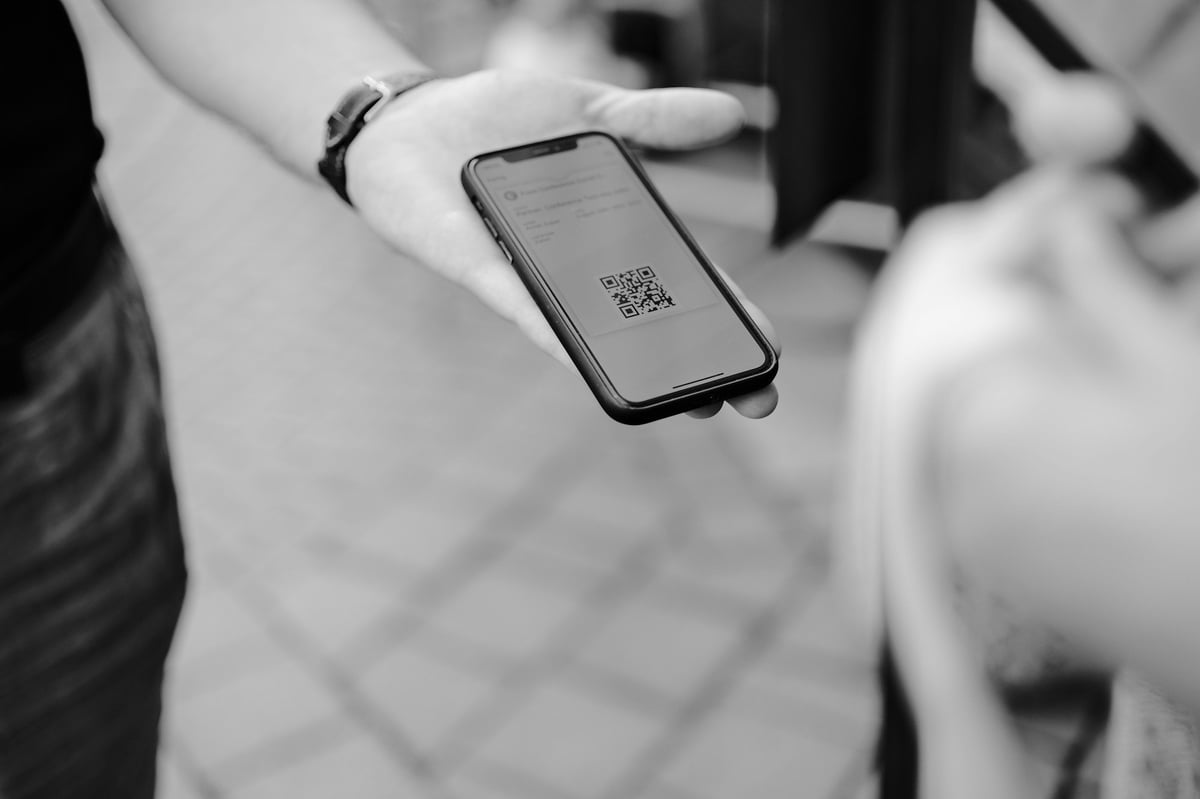 A phone displaying a QR code