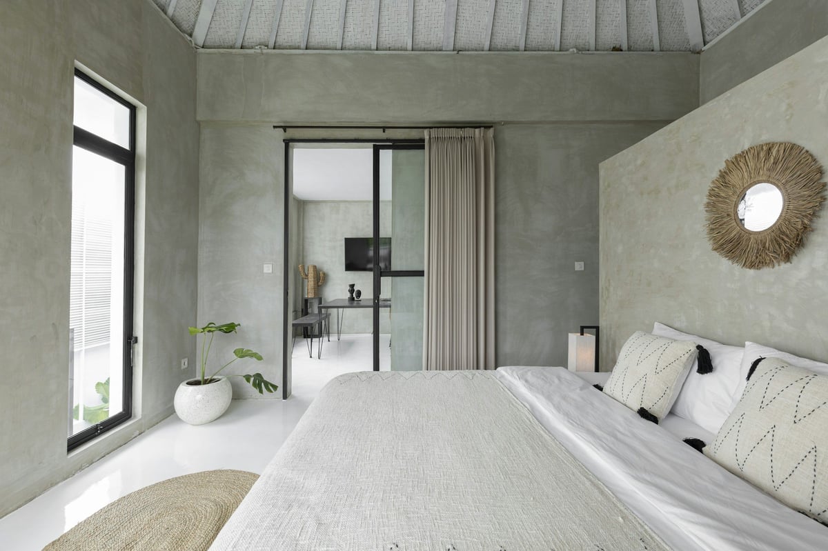 A modern villa bedroom with a large window
