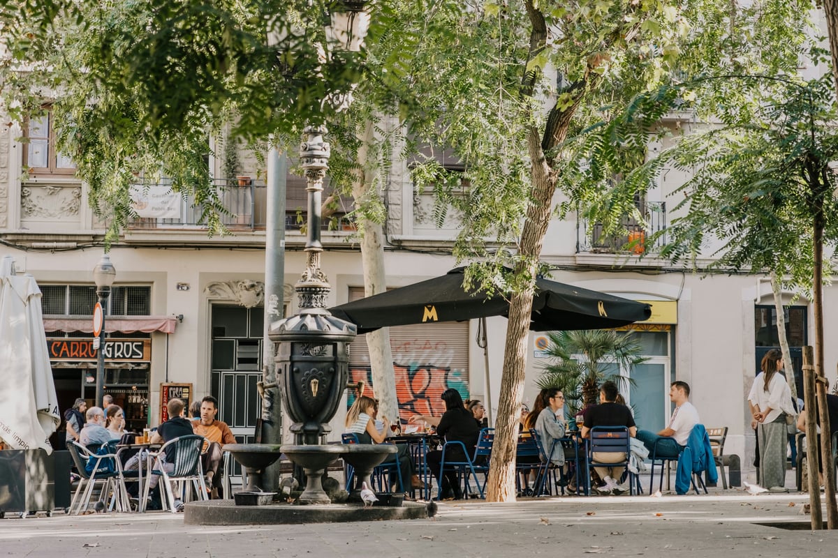 A busy tourist-area restaurant terrace in Barcelona still open and full in summer