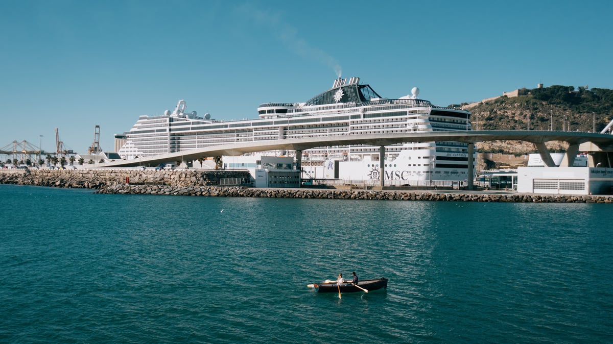 A large ferry docked at the Port de Barcelona, ready to depart for the Balearic Islands