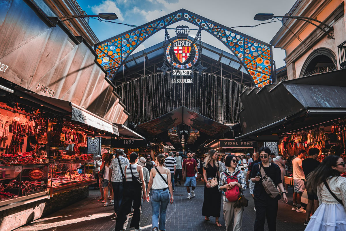 A vibrant tapas spread or a market food stall — colorful, appetizing, Barcelona-specific