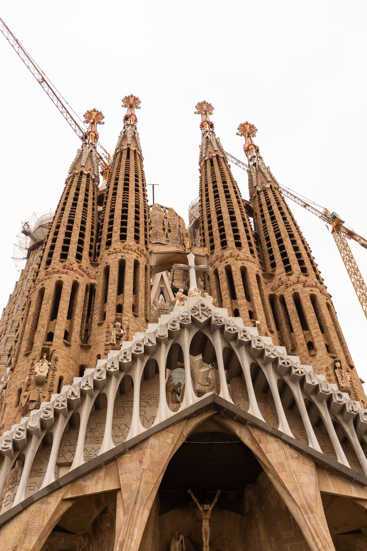 Sagrada Família exterior with the completed Tower of Jesus Christ, ideally with the new cross visible against 