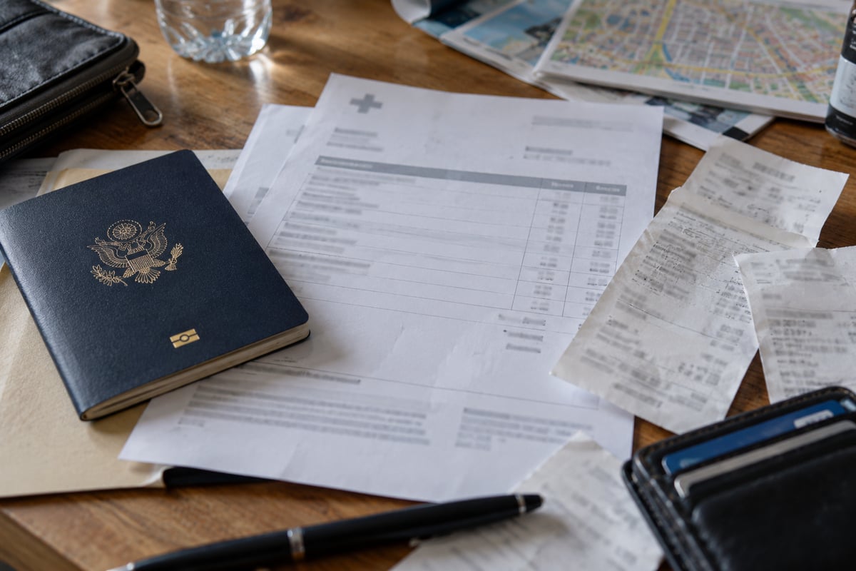 An itemized medical invoice and passport, the documents needed for a travel insurance claim