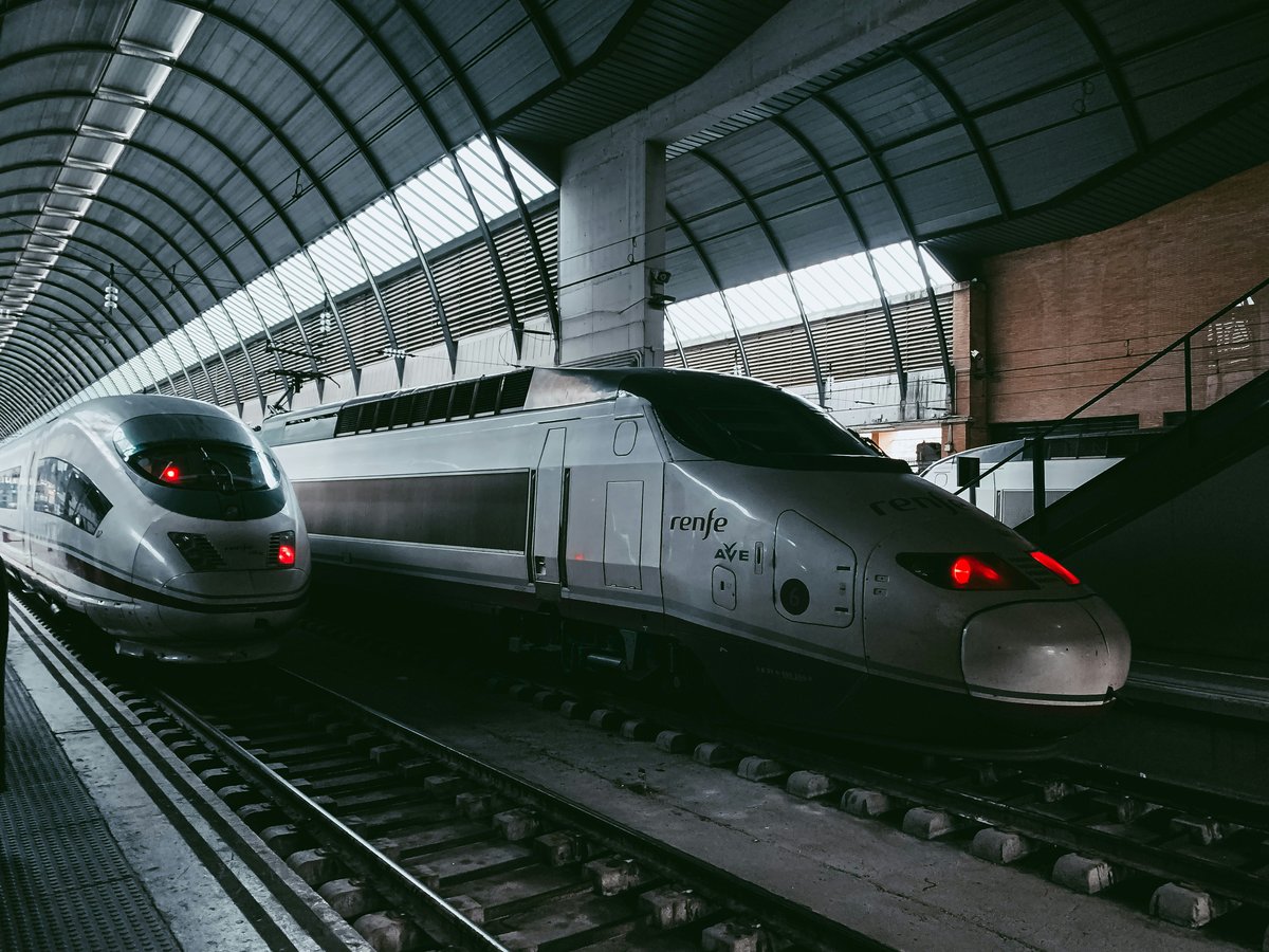 A high-speed AVE train arriving at a Spanish station platform