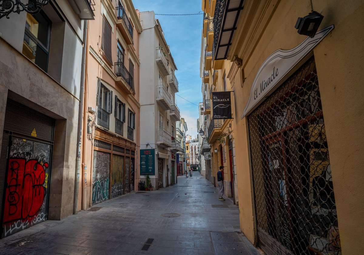 A shuttered storefront in Barcelona on a public holiday