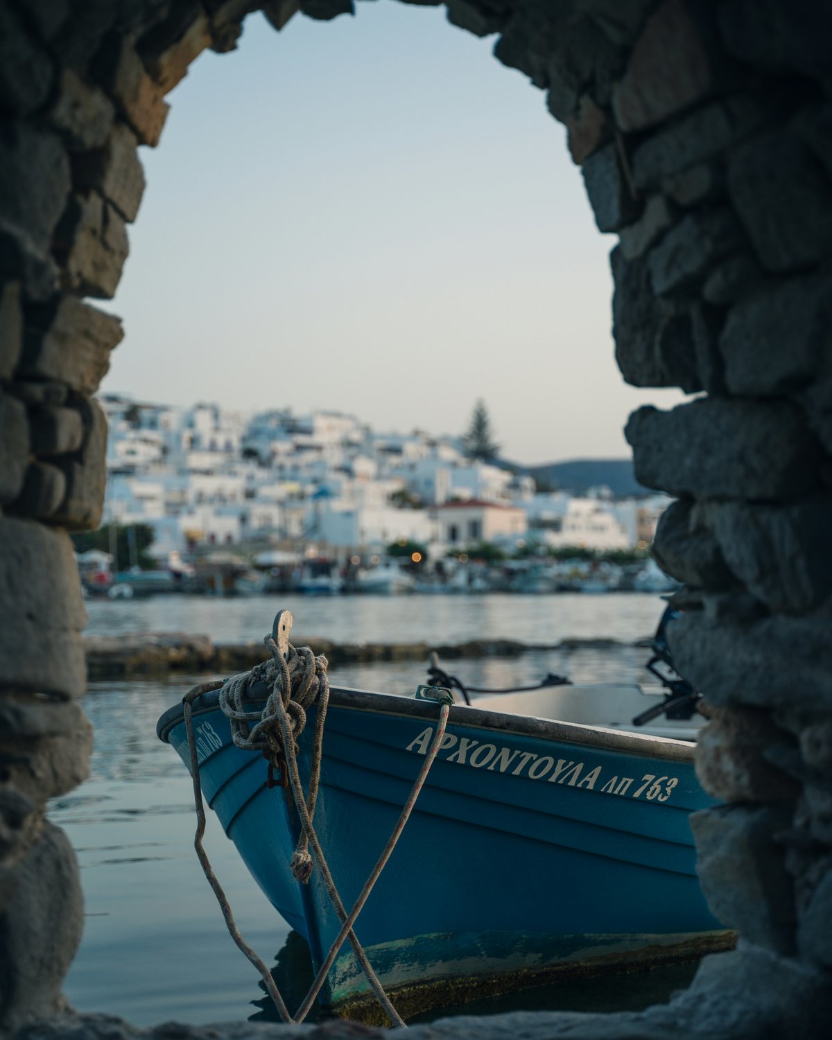 Naoussa harbor on Paros at dusk, fishing boats and waterfront tavernas