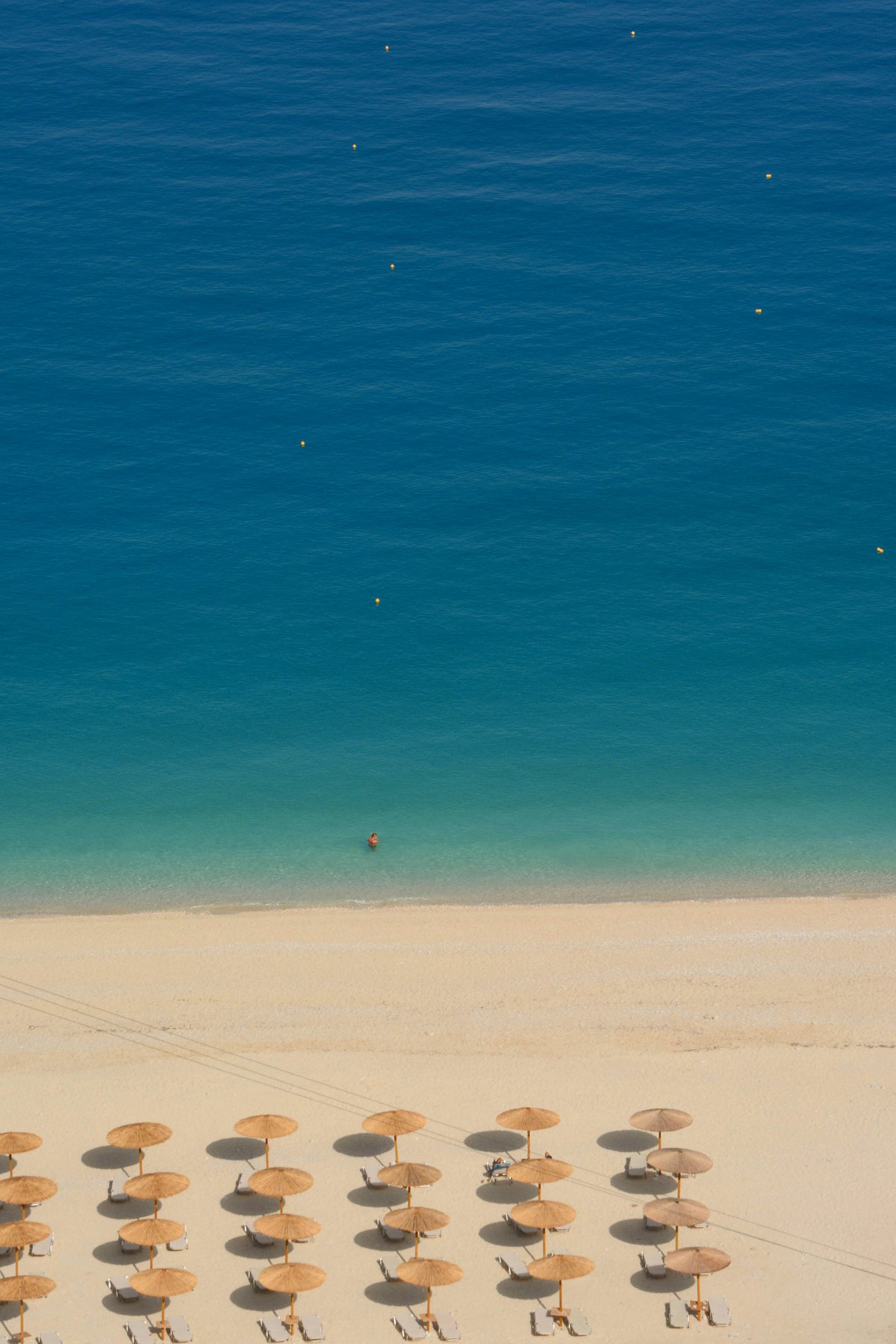 A stunning turquoise Greek island beach with clear water