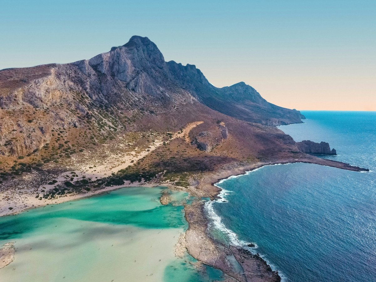 A famous lagoon beach like Balos or Elafonisi with pink sand and turquoise water