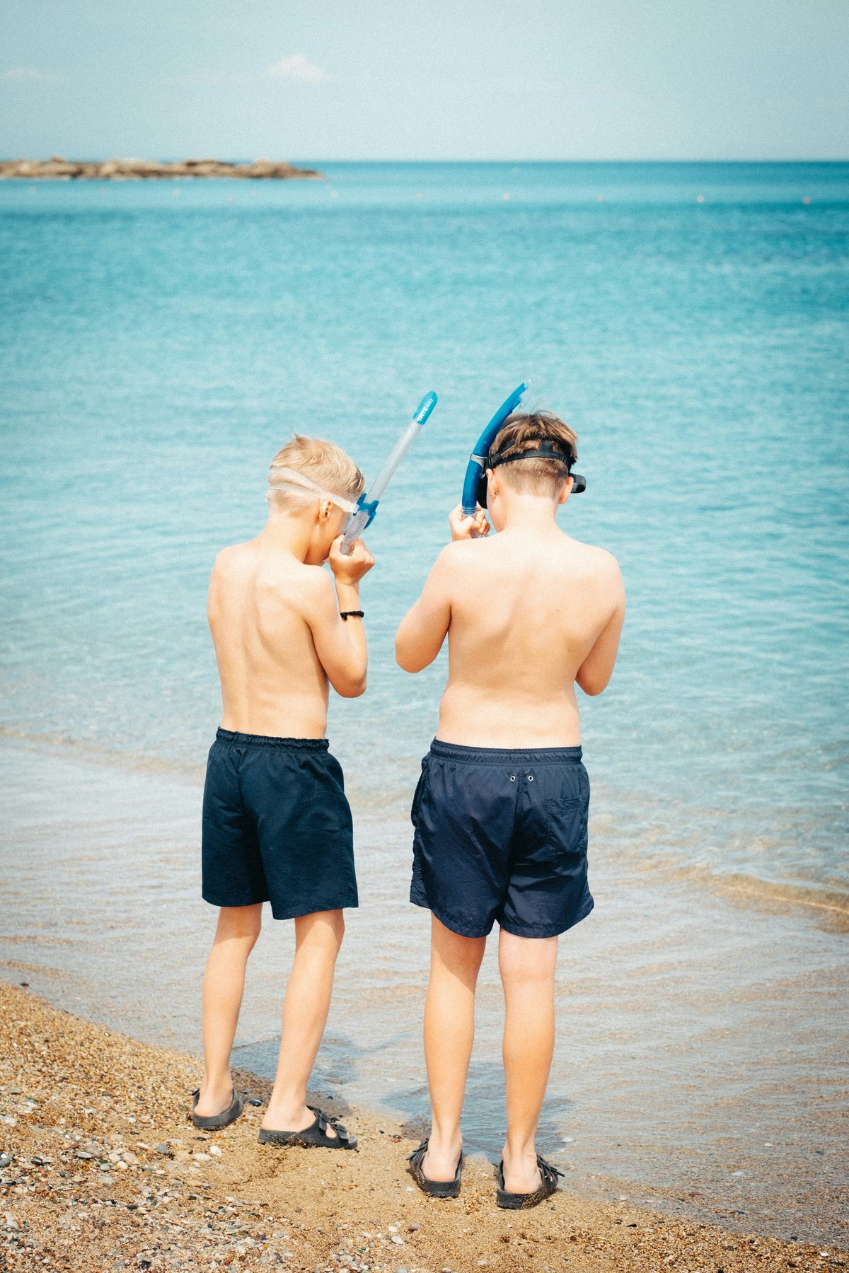 A family-friendly beach or a fun ancient site with kids exploring (no identifiable faces)