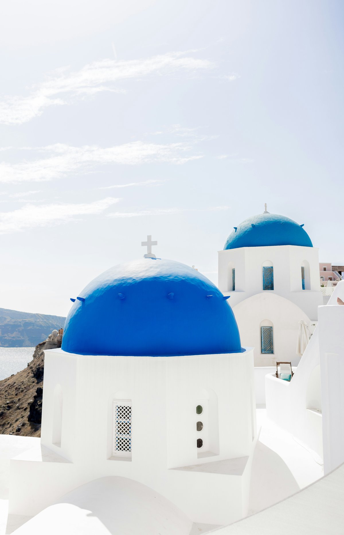 A classic Cycladic island view — white village, blue domes, sea