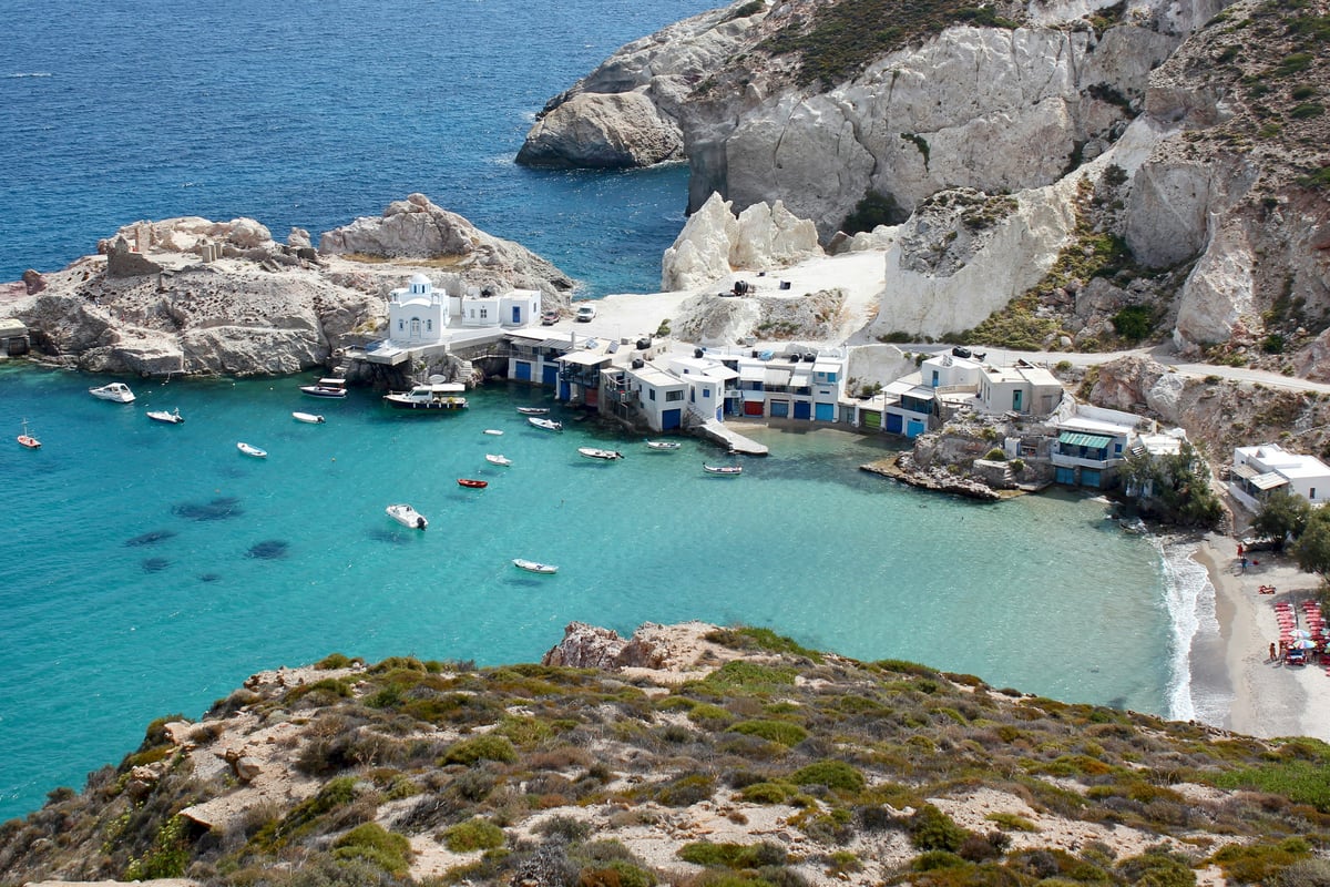 A sunny Greek island scene evoking ideal travel weather
