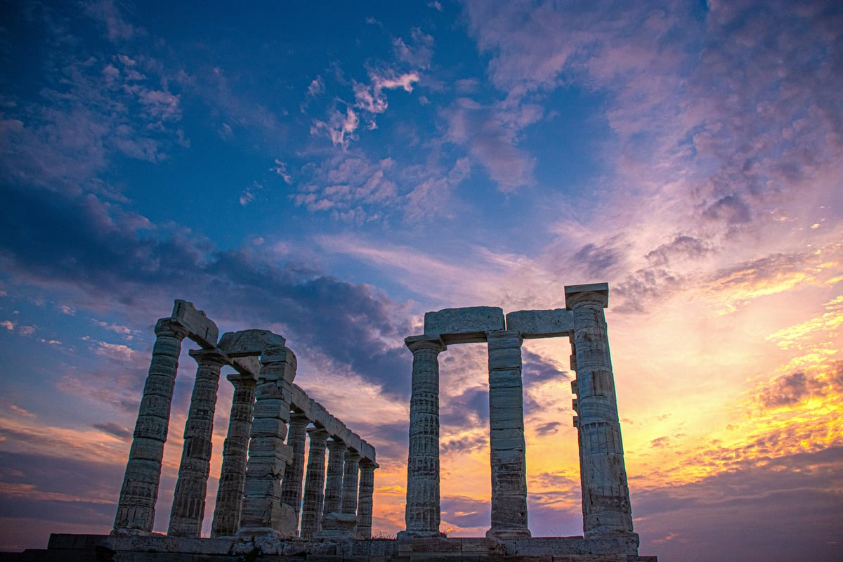 The marble columns of the Temple of Poseidon glowing at sunset