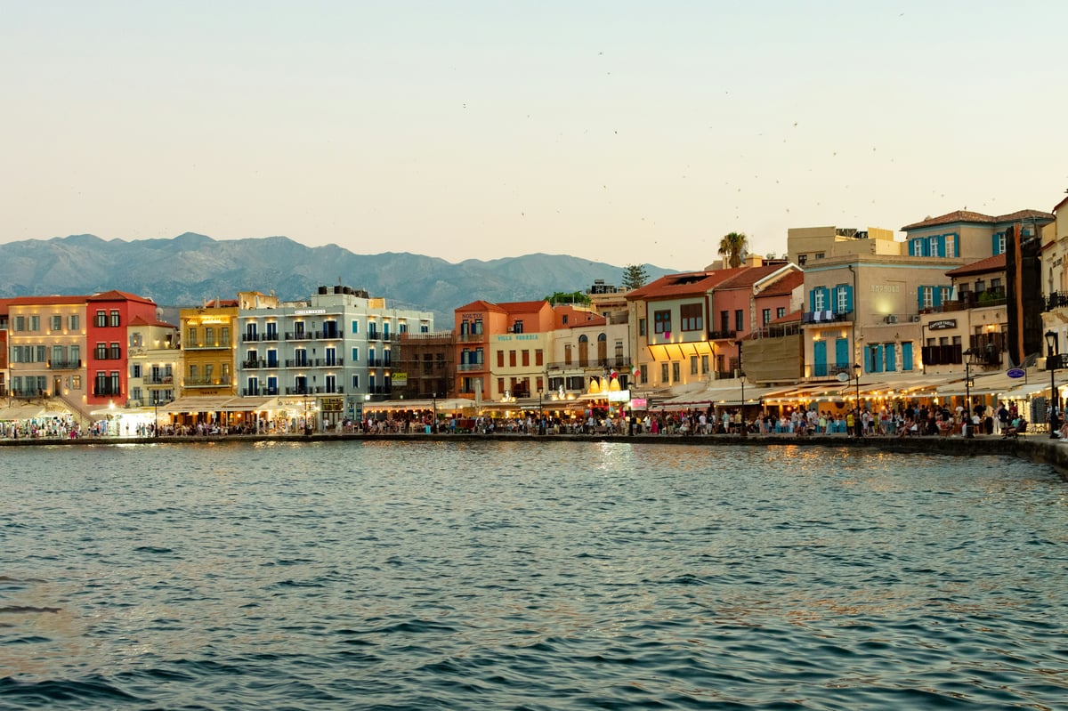 Chania's Venetian harbour with the old lighthouse at golden hour