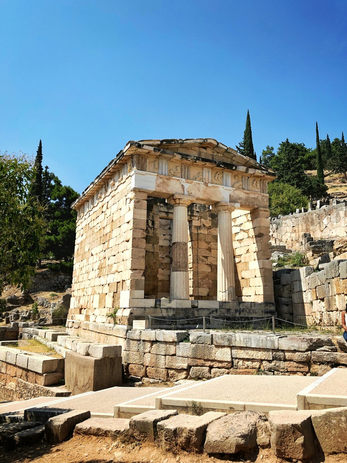 The ruins of Delphi on the slopes of Mount Parnassus with mountain views