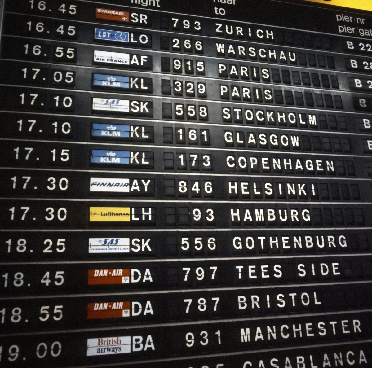 An airport departures board or a traveler with luggage at the gate