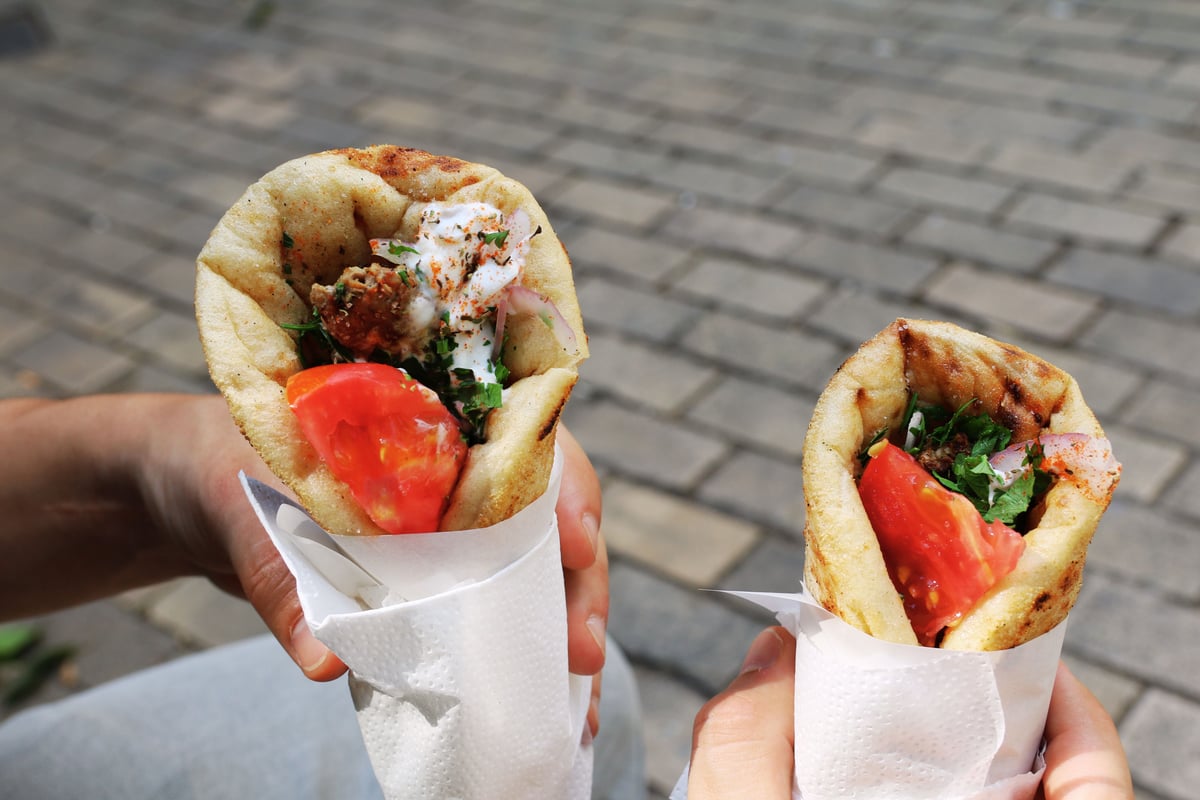 A cheap, delicious gyros/souvlaki or a casual local taverna spread