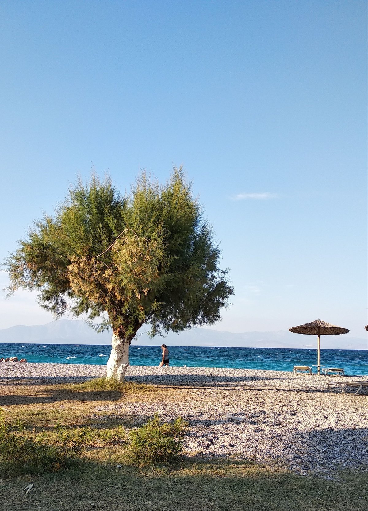 A sunny but uncrowded Greek island scene in spring or early fall