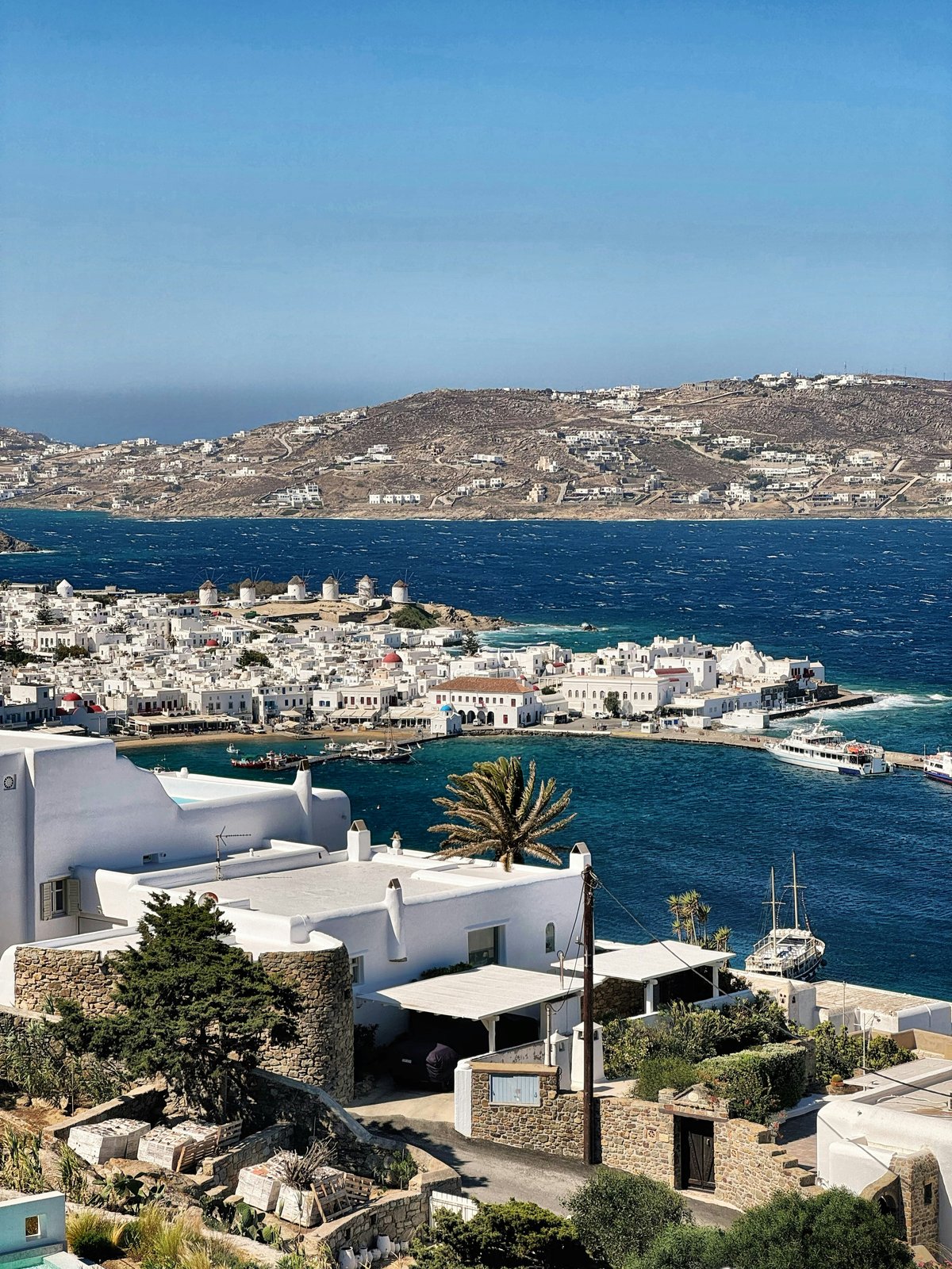 A scenic Greek island view evoking an aspirational but attainable trip