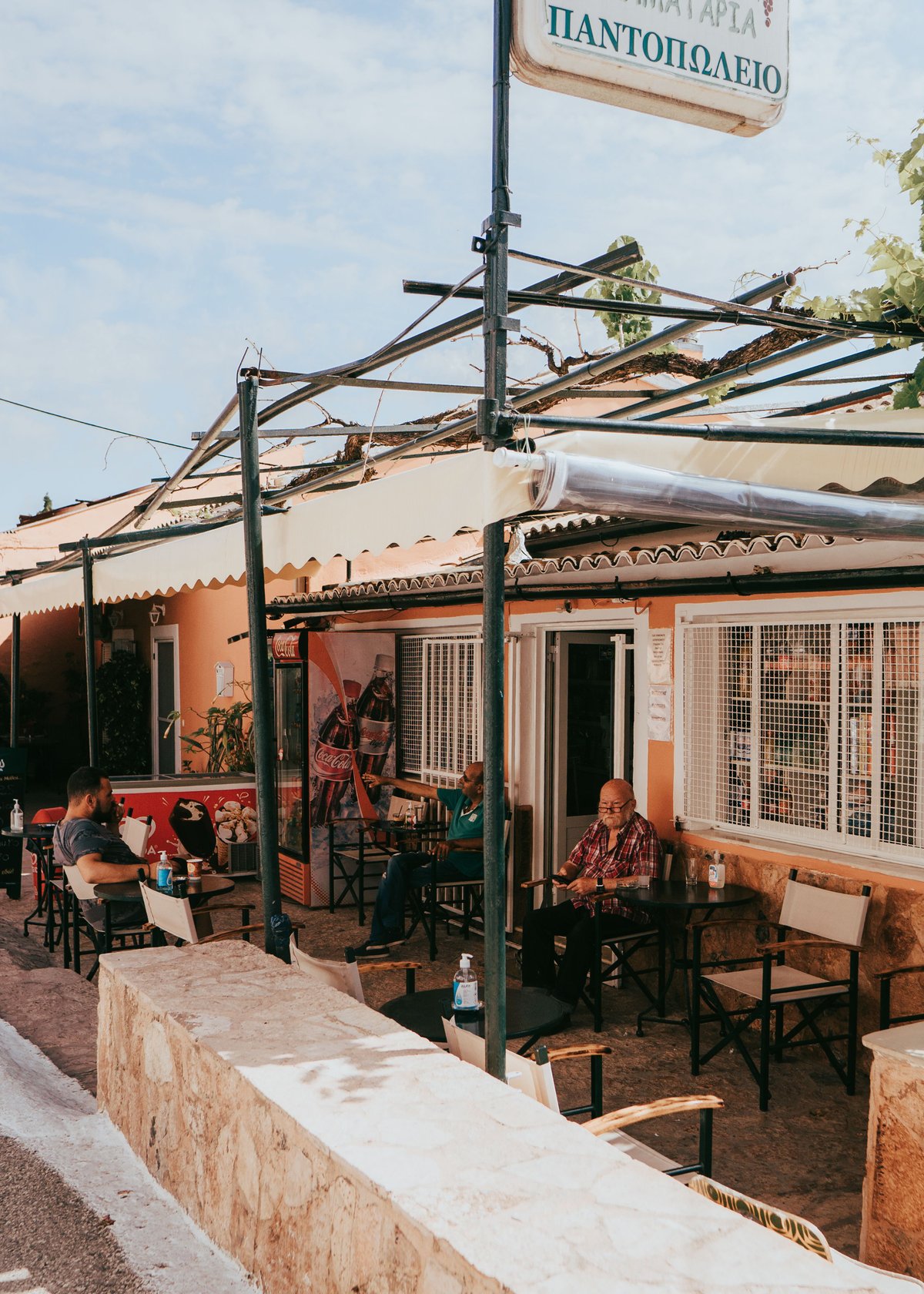Friendly locals greeting or chatting in a Greek village or town