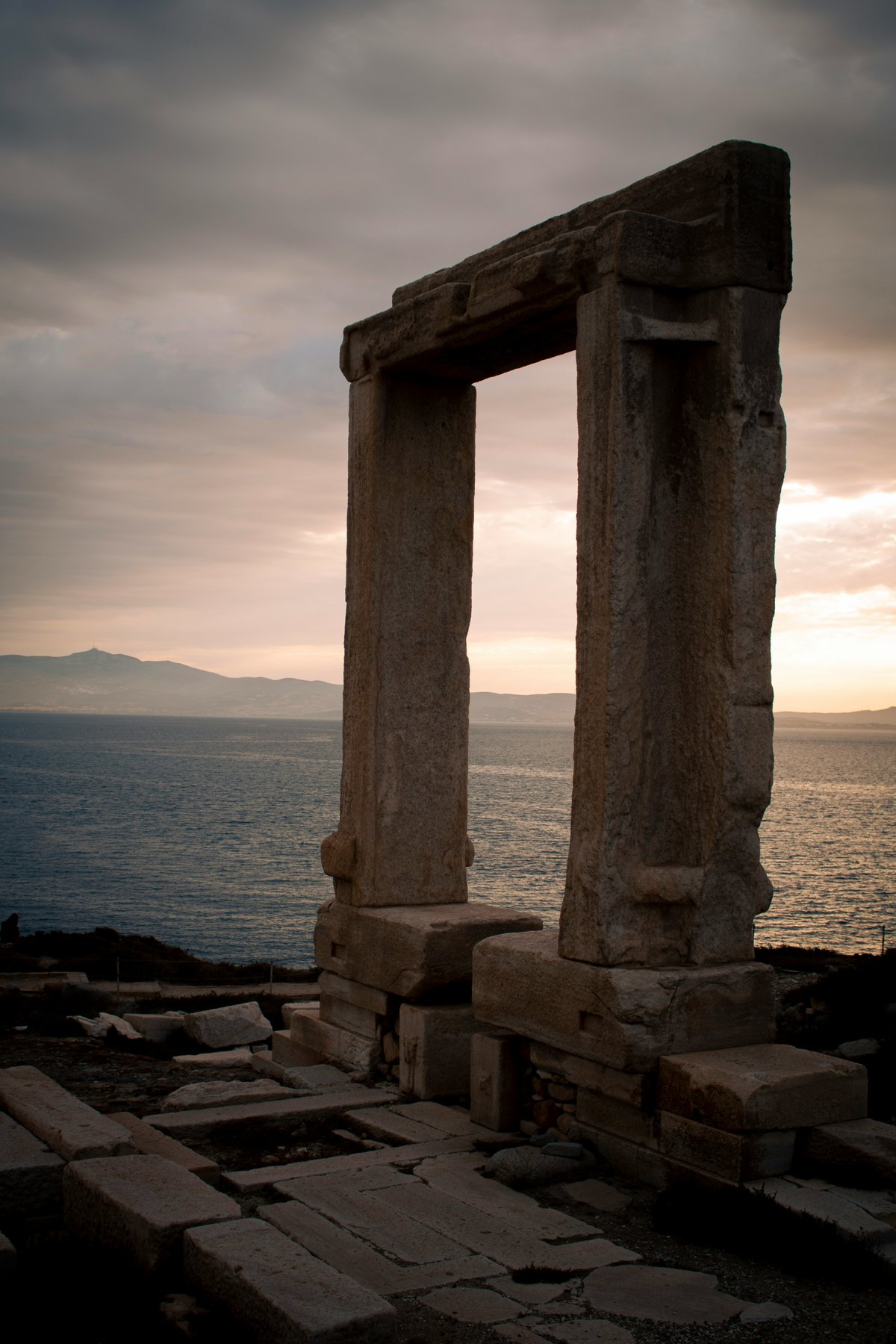The marble Portara gateway on Naxos silhouetted at sunset