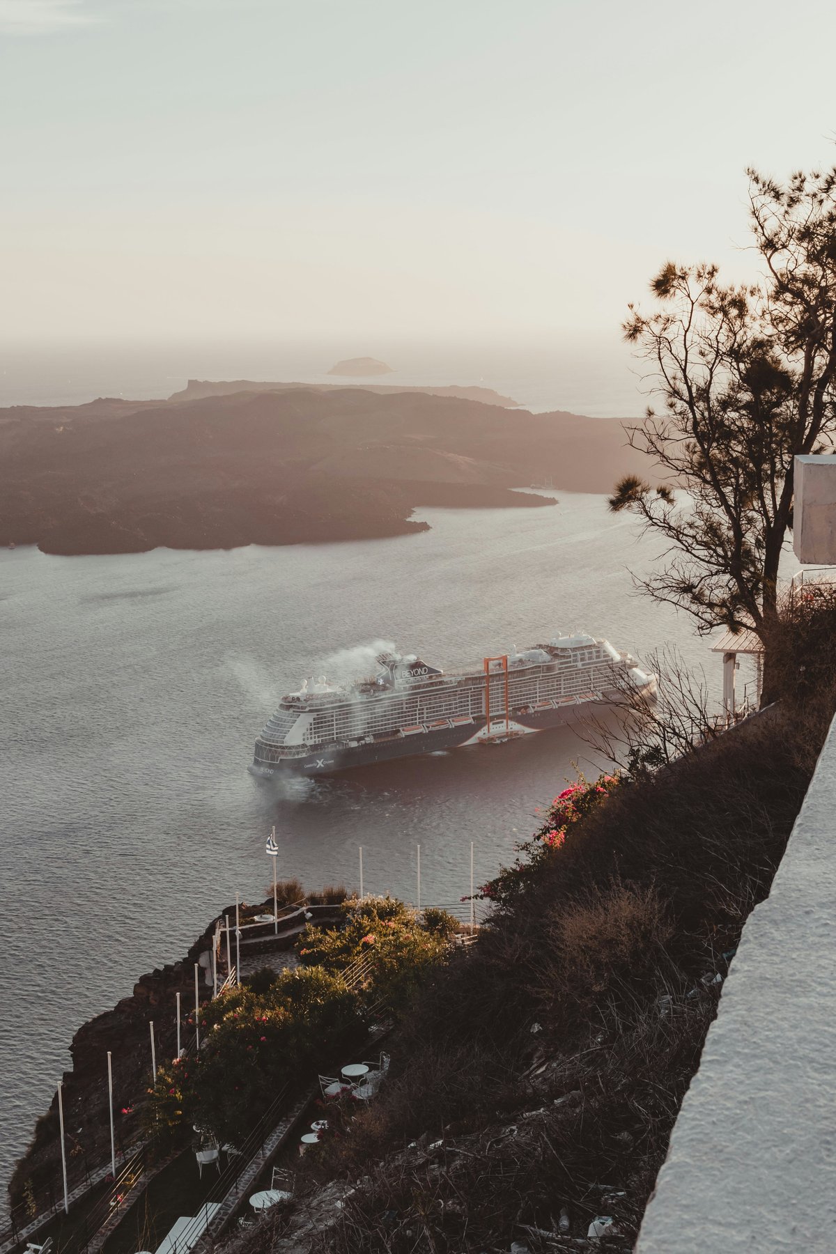 Cruise ships anchored in the Santorini caldera seen from the cliff above