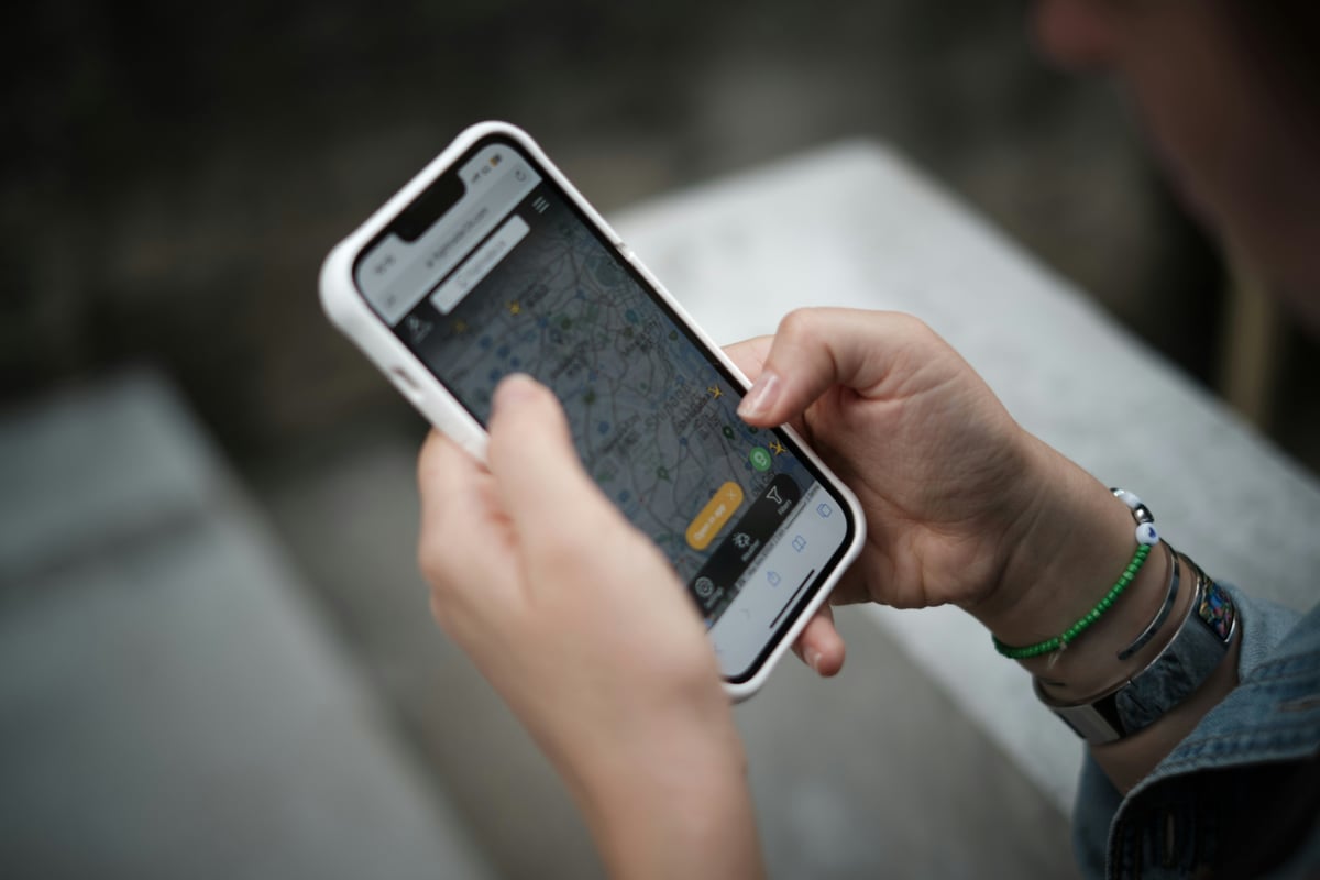 A phone showing a map or travel app, Greek setting