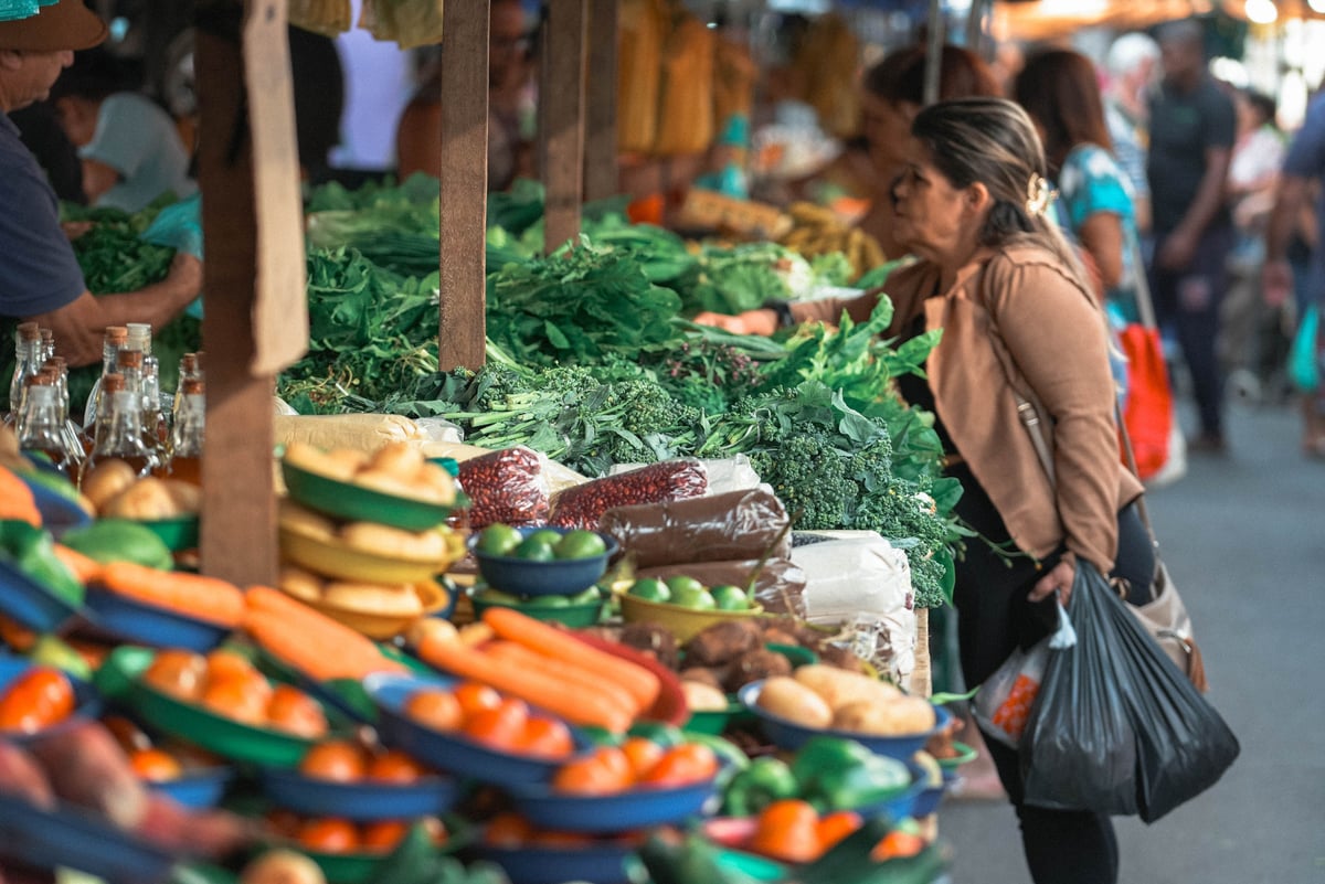 A friendly interaction at a Greek market or taverna