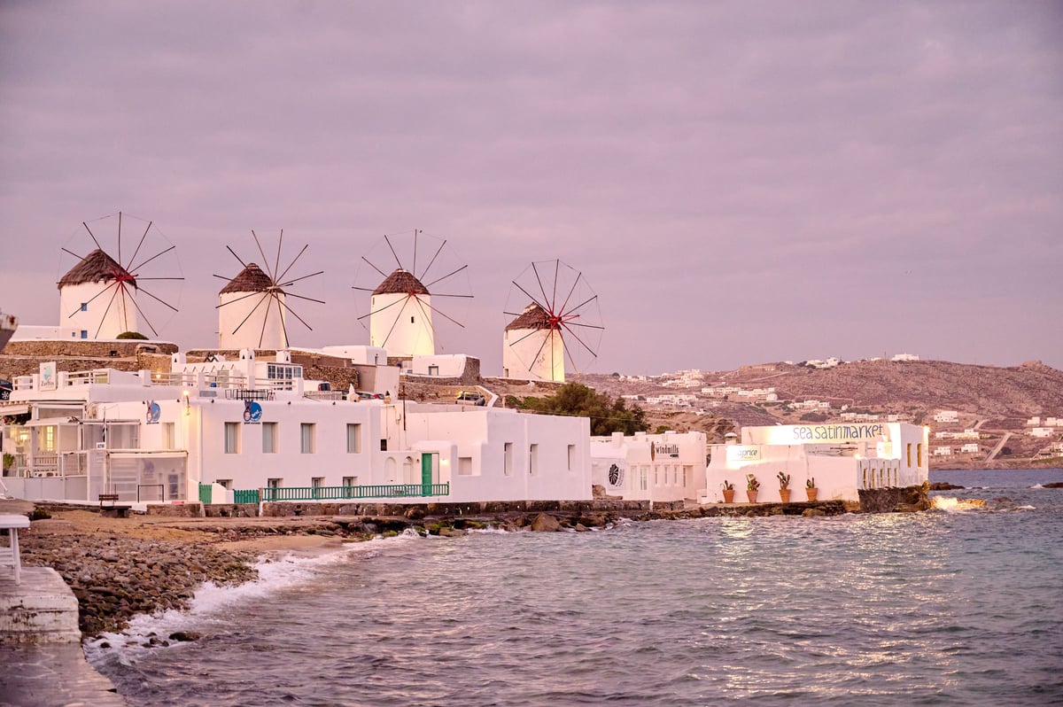 Mykonos Town whitewashed lanes and Little Venice waterfront at golden hour