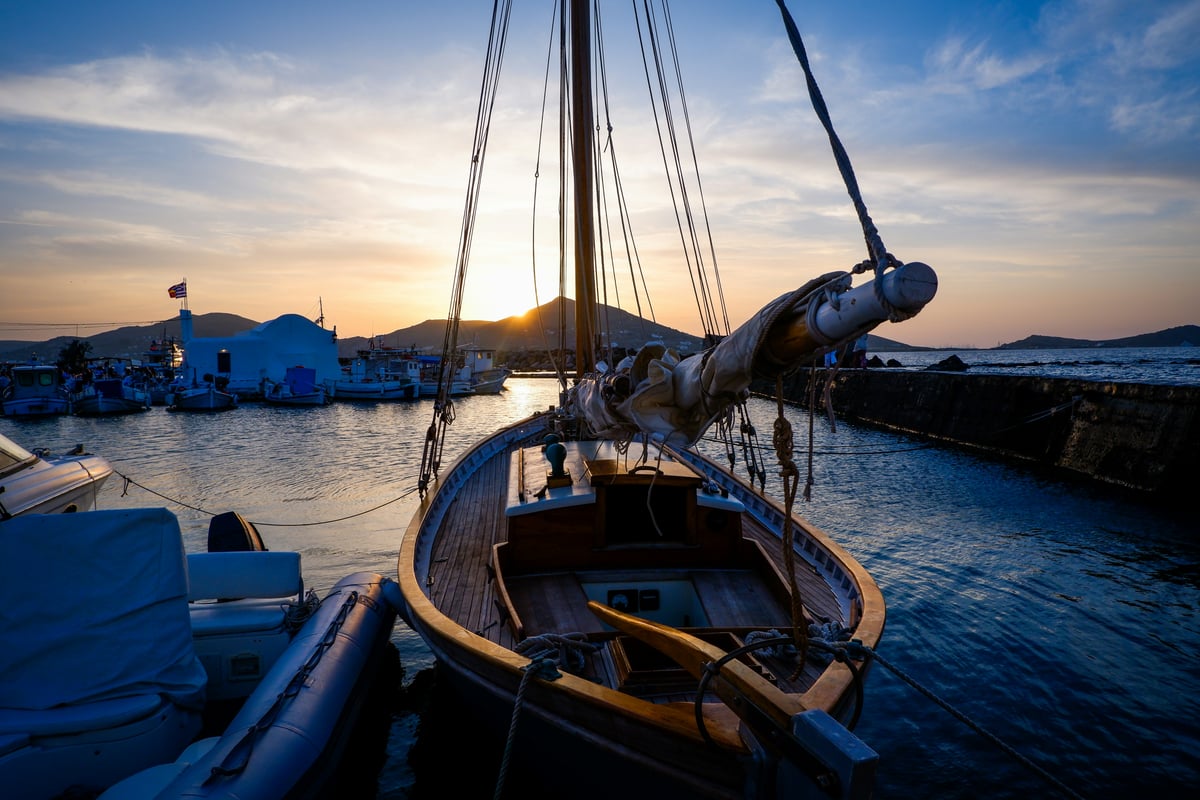 Naoussa harbor on Paros at dusk, fishing boats and waterfront tavernas