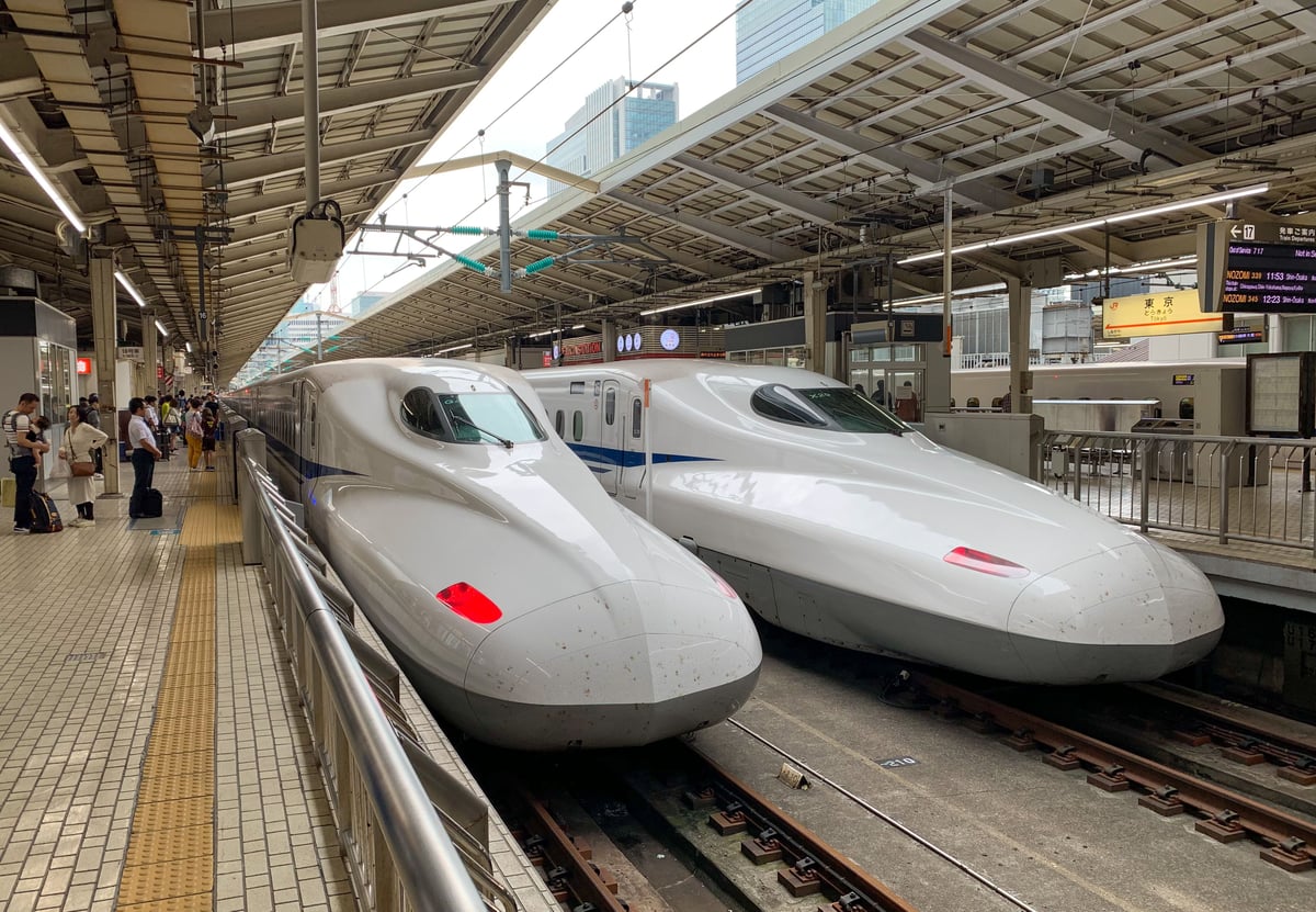 Two Shinkansen bullet trains at a Tokyo Station platform