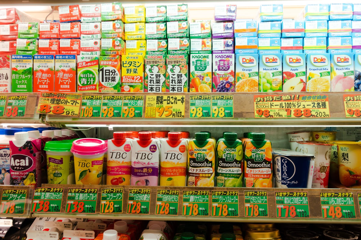 Well-stocked drink shelves inside a Japanese convenience store