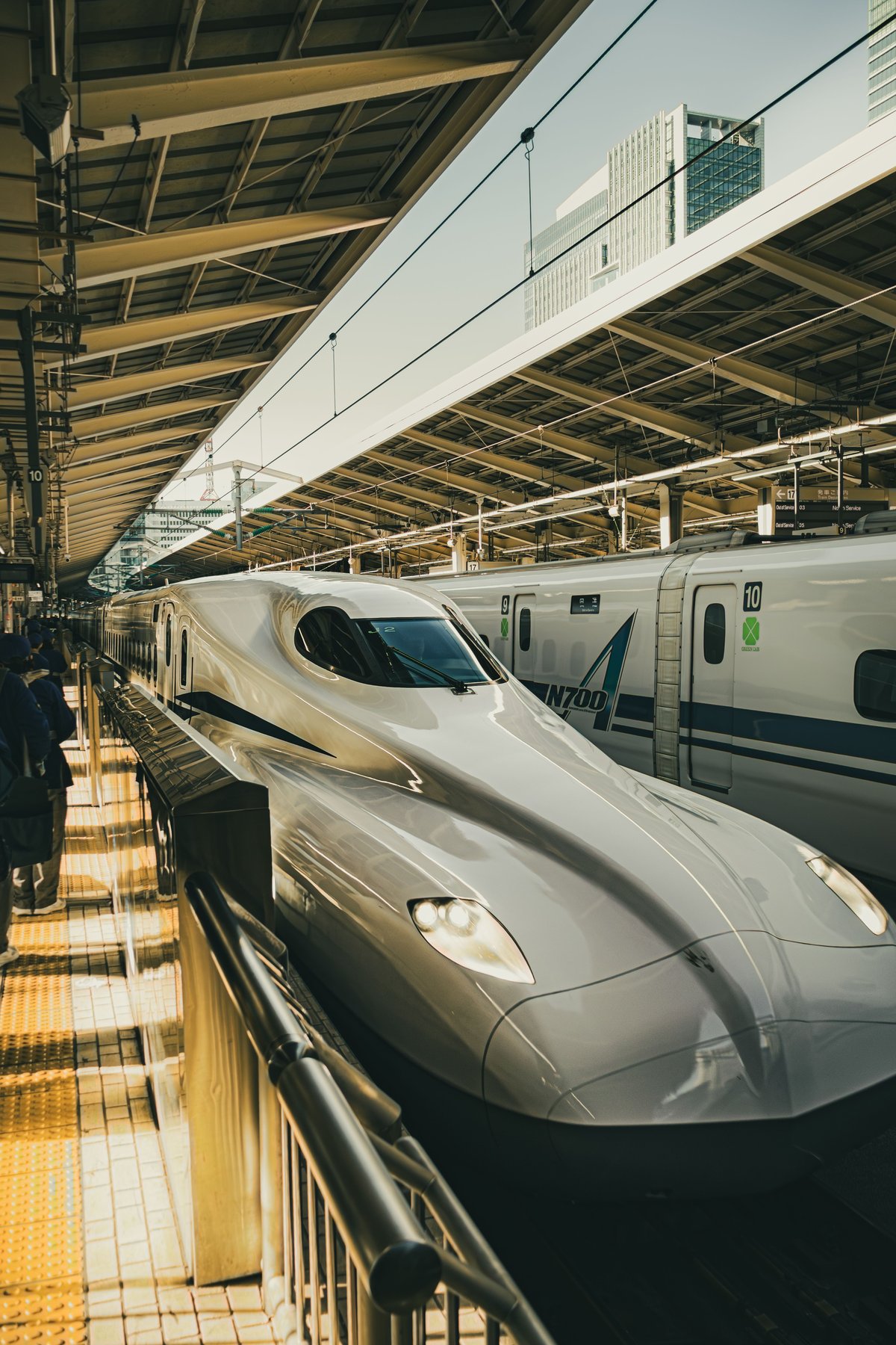 An N700 Shinkansen bullet train at a station platform