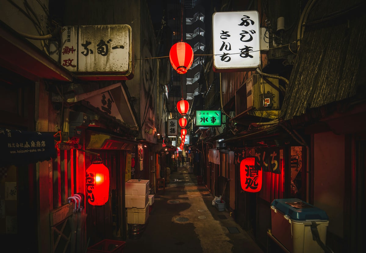 A quiet lantern-lit alley in Tokyo at night