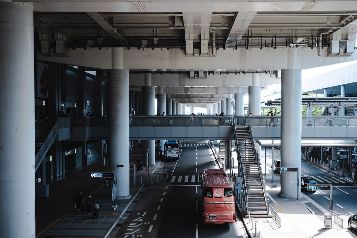 Kansai International Airport terminal exterior with buses and taxis
