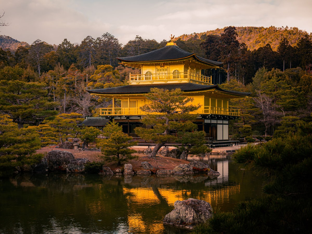 The Golden Pavilion (Kinkaku-ji) at sunset reflected in its pond