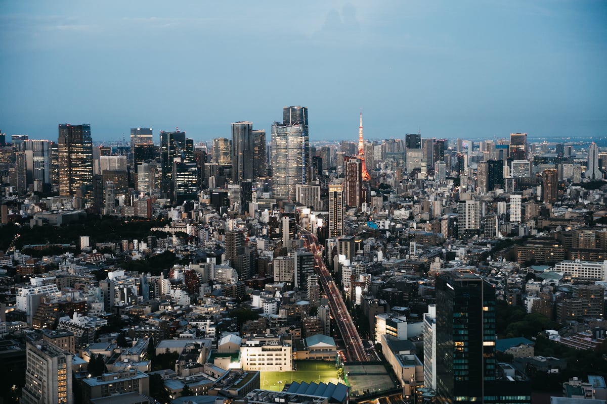 The Tokyo skyline at dusk with Tokyo Tower illuminated