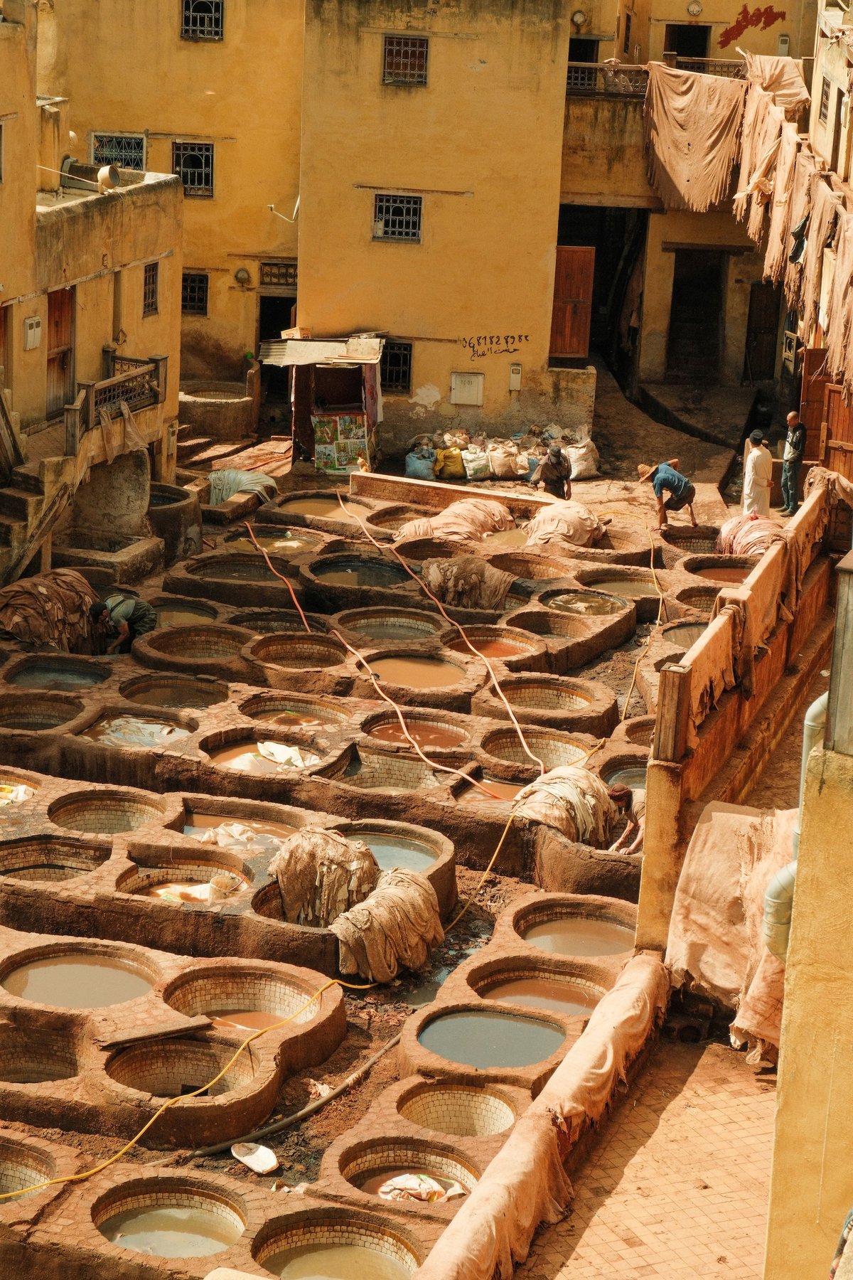 The Chouara tannery dye pits in Fez viewed from above, no clear faces