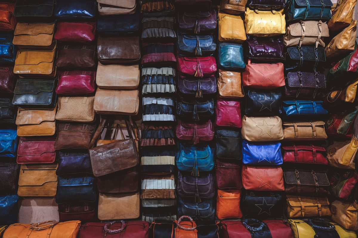 Colorful leather goods displayed in a Fez shop, no faces