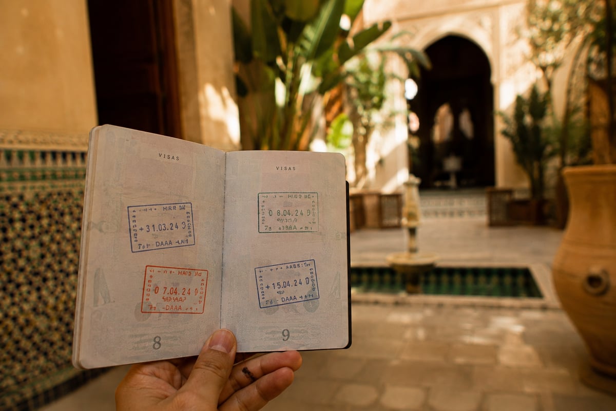 A passport open to a page with entry stamps, no personal details visible