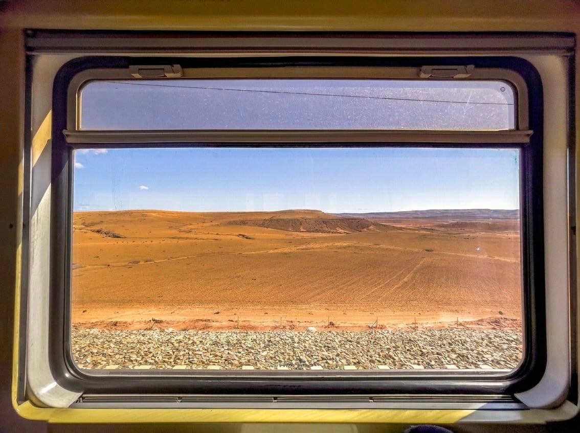 A train window view of the Moroccan countryside, no faces