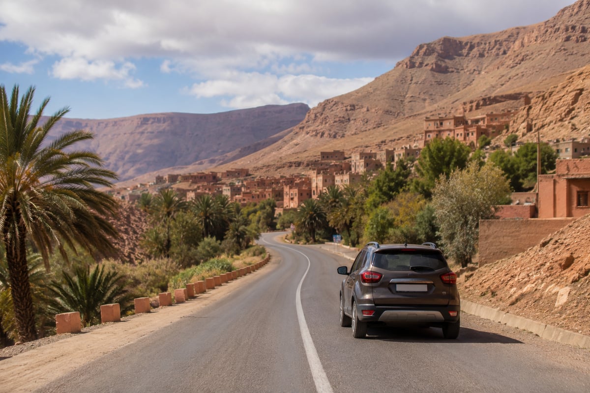 A rental car on an open road through the Moroccan countryside, no faces or plates