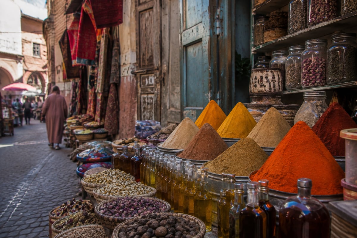A Moroccan shop display of lamps, rugs and ceramics, no faces