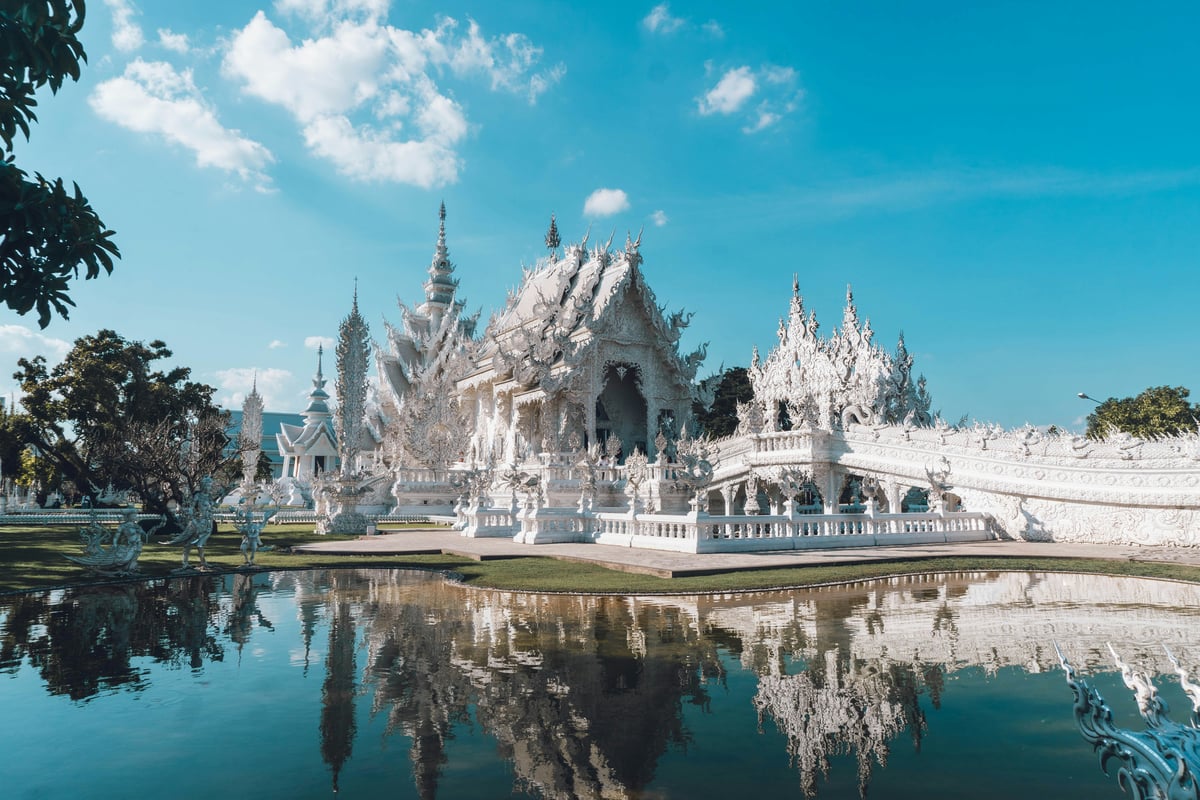 Chiang Rai's White Temple, or a misty northern mountain scene