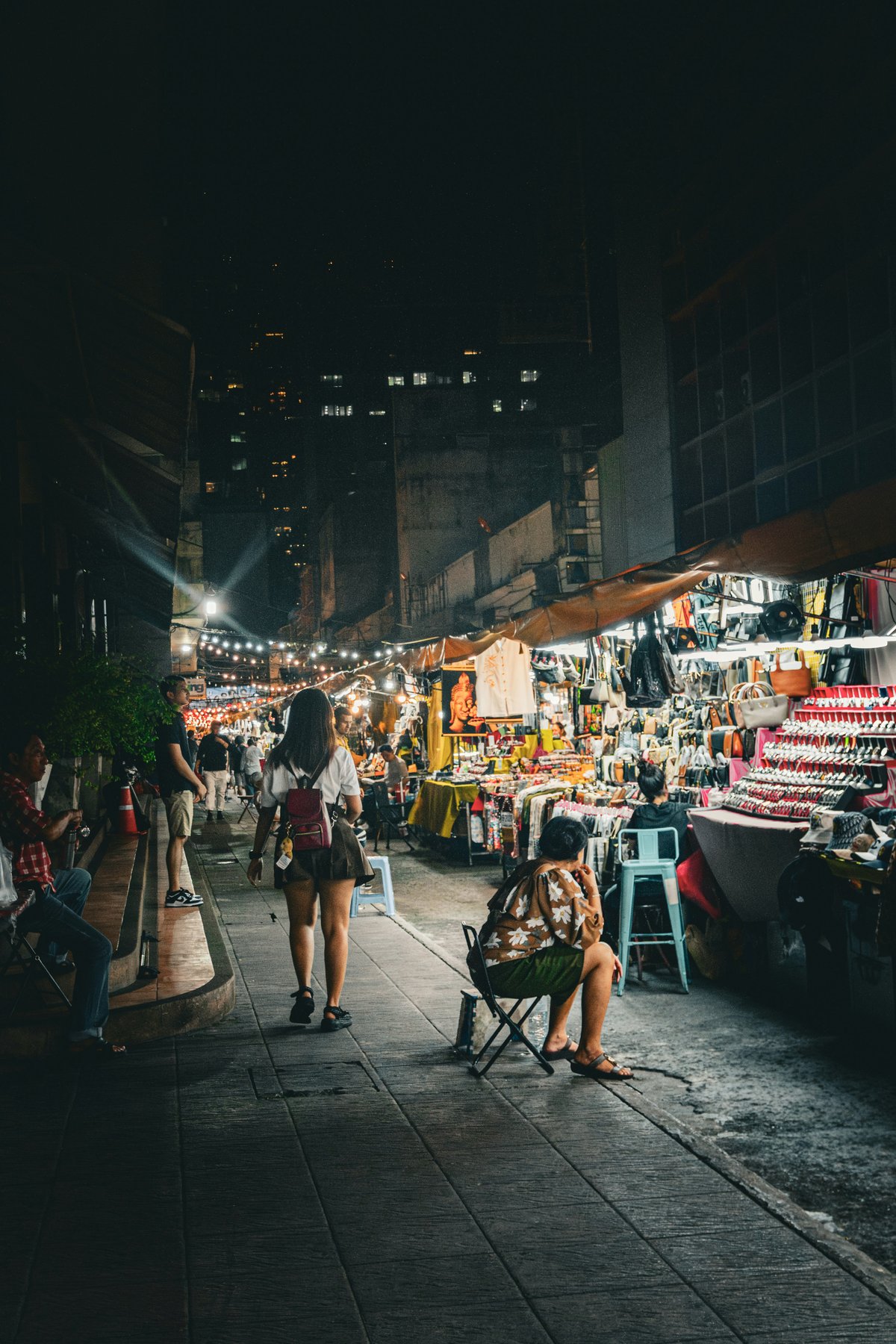 A lively Bangkok night market with food stalls and bars