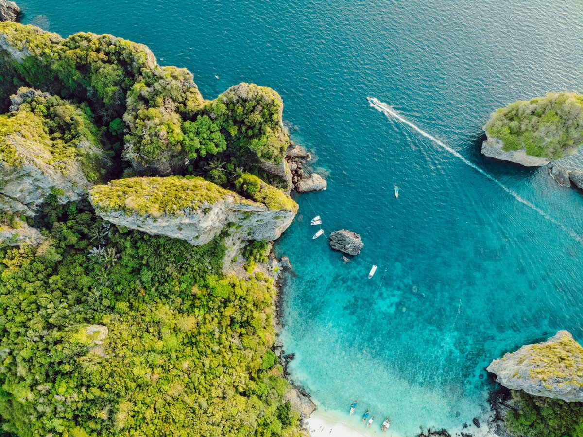 A map-like wide shot suggesting island-hopping across turquoise sea