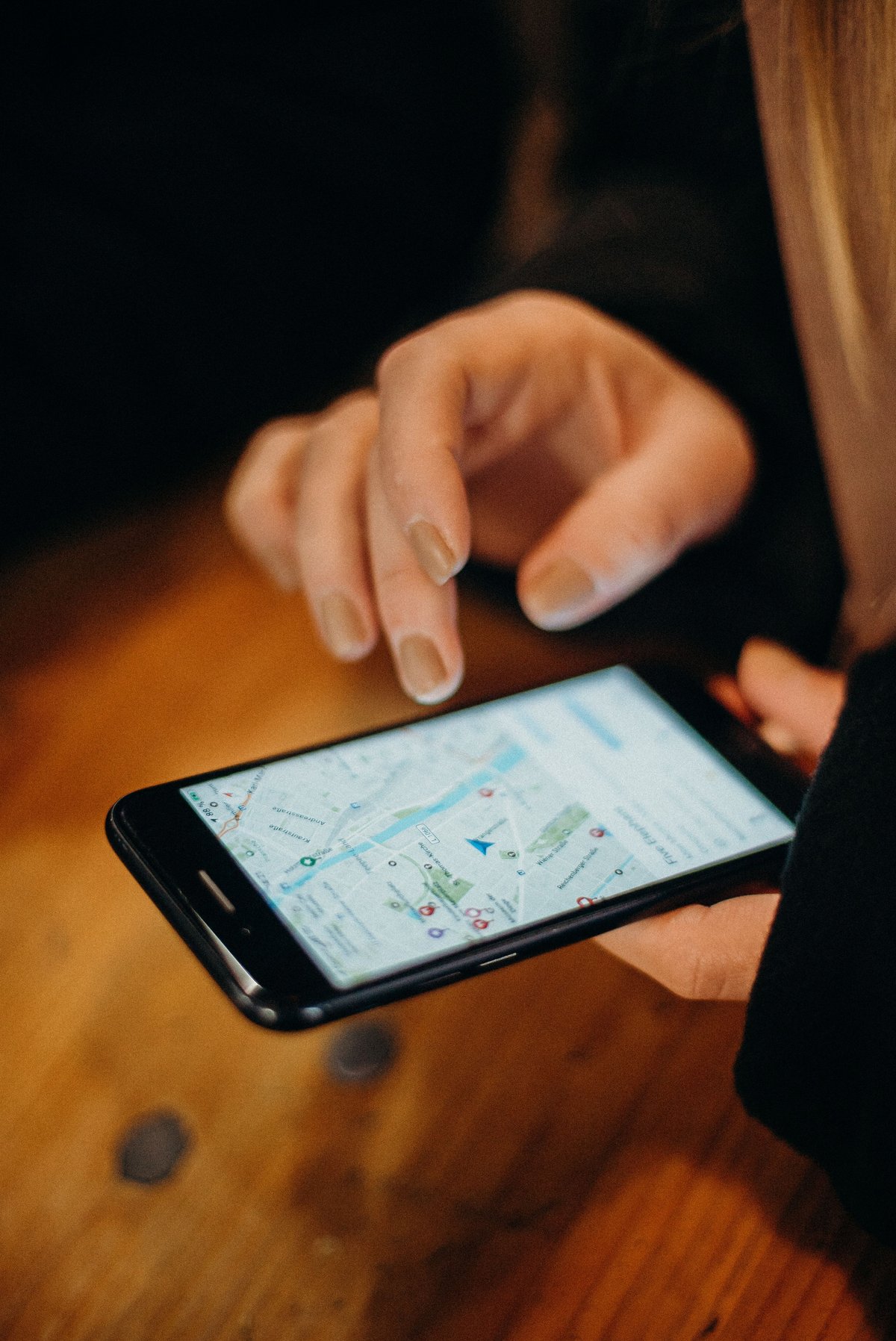 Close-up of a phone showing the Grab app or a map of Bangkok