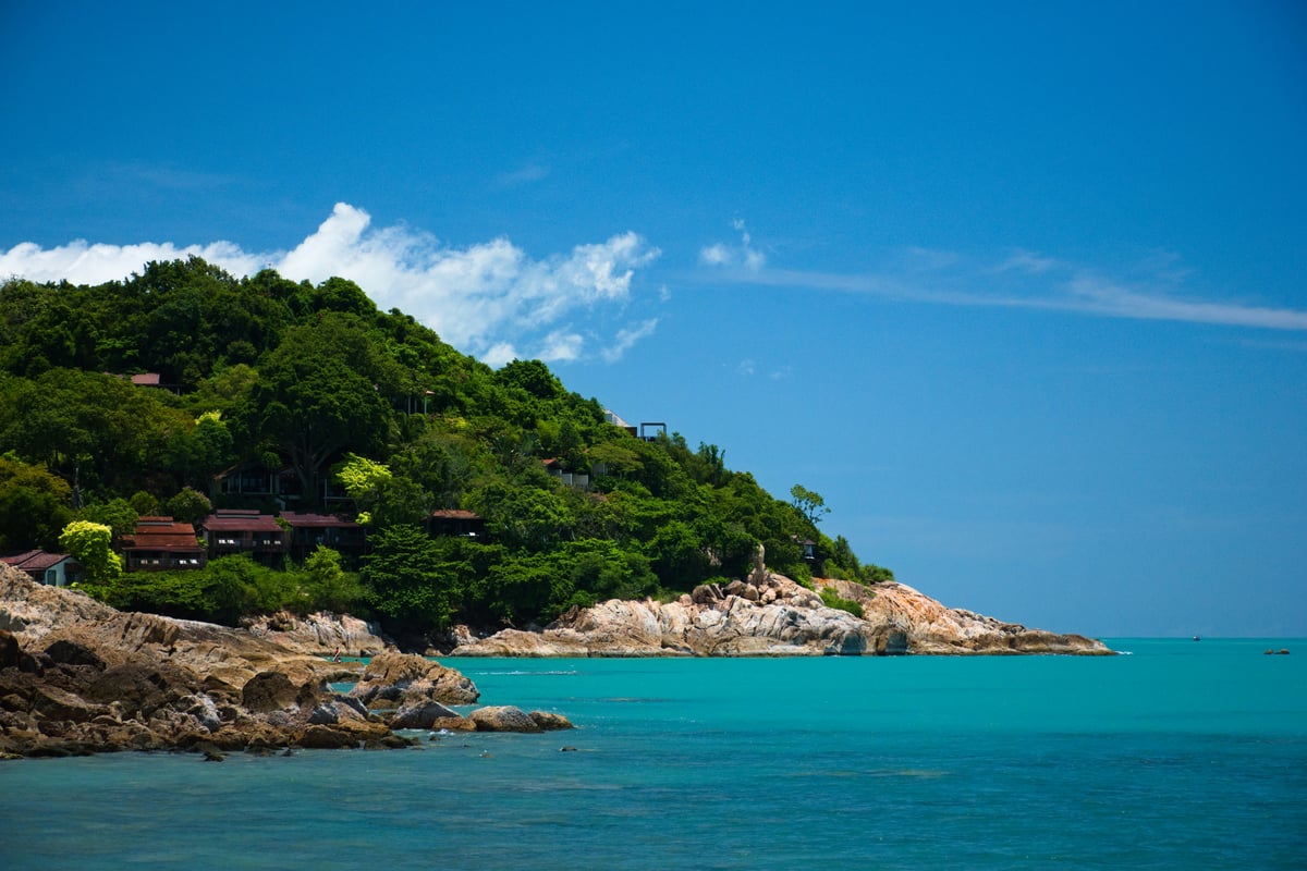 A luxurious Thai beachfront resort pool overlooking the sea