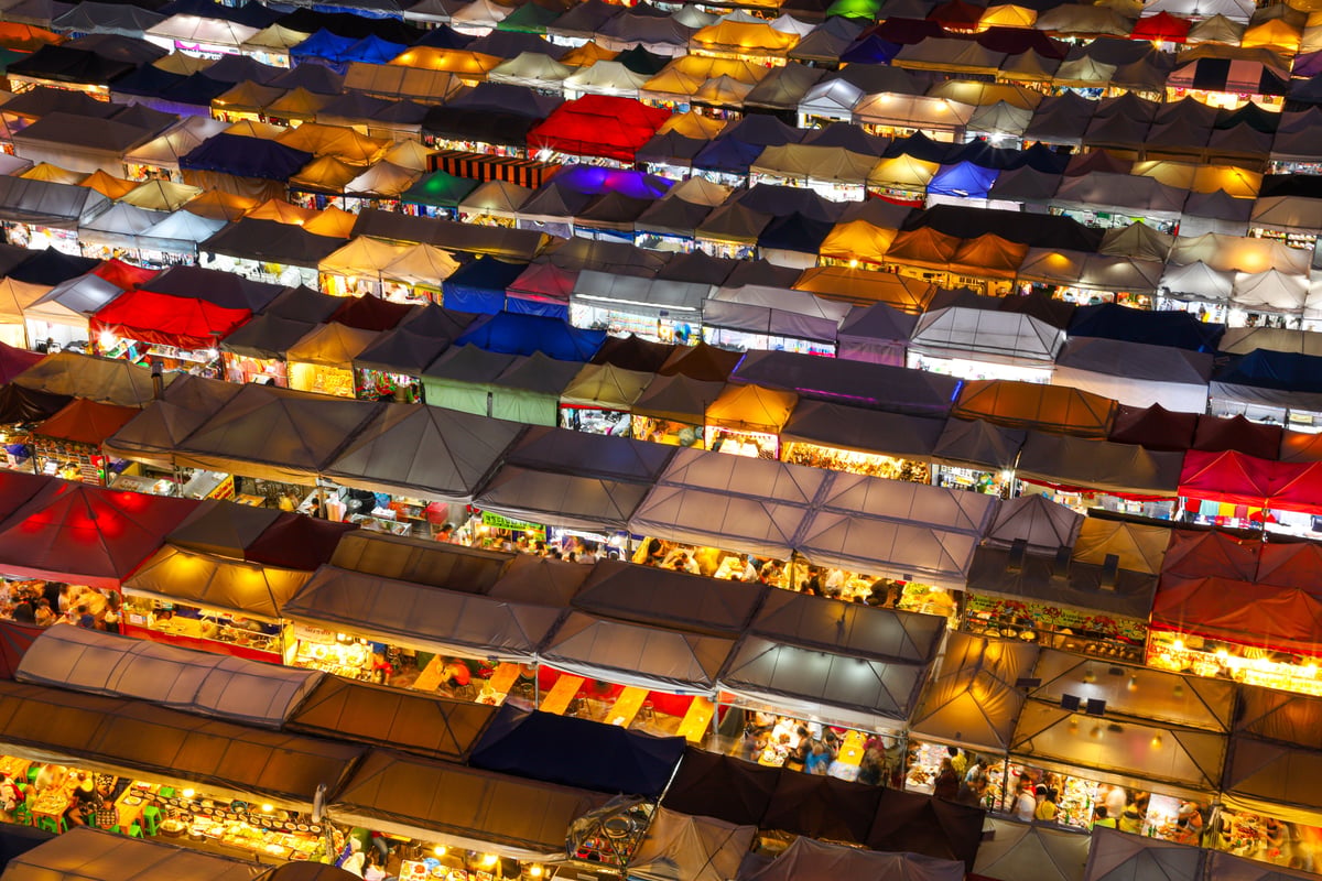 Chatuchak market stalls or a colorful floating market scene